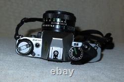 Canon AE-1 Program 35mm Manual SLR Film Camera with 50mm 11.8 Lens