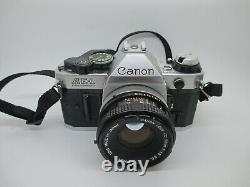Appareil photo argentique reflex Canon AE-1 Program 35mm avec objectif 50mm f/1.8 FD FONCTIONNE PARFAITEMENT