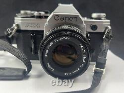 Appareil photo reflex argentique Canon AE-1 avec objectif FD 50mm 1:1.8