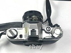 Appareil photo reflex argentique Canon AE-1 avec objectif FD 50mm 1:1.8